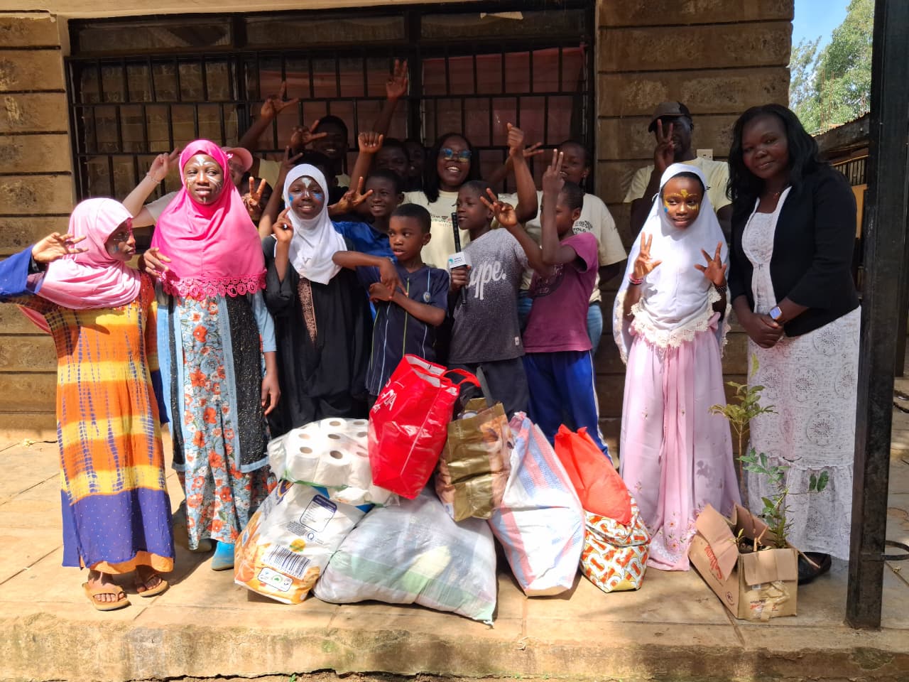 Ubuntu Retold team with children of Mama Fauzia Children's Home on Africa Day 2026