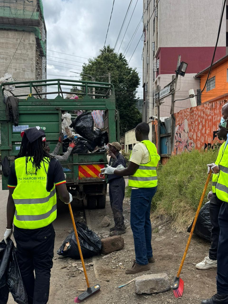 Volunteers loading collected waste during the Langata cleanup